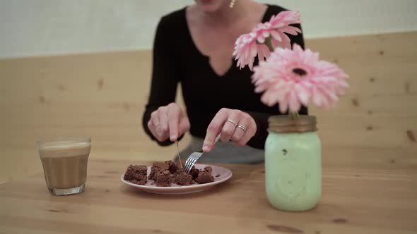 Woman eating dessert in cafe