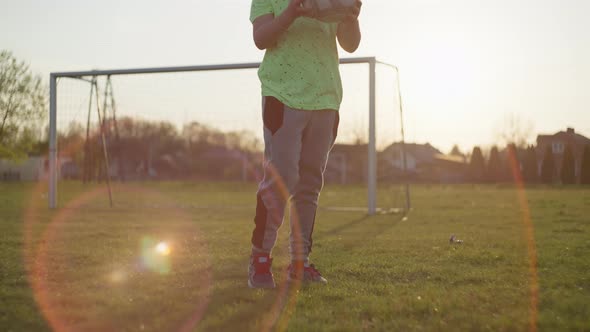 The Boy Learns to Control the Ball for Playing Football