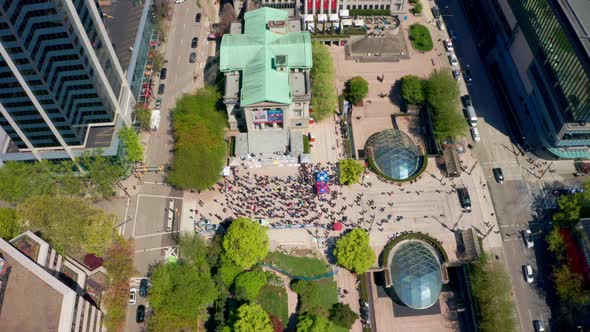 Birds-eye Aerial View of a Crowd of People at the Vancouver Art Gallery on a sunny summer day in UHD