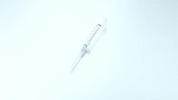 Medical Syringe on White, Rotation, Reflection