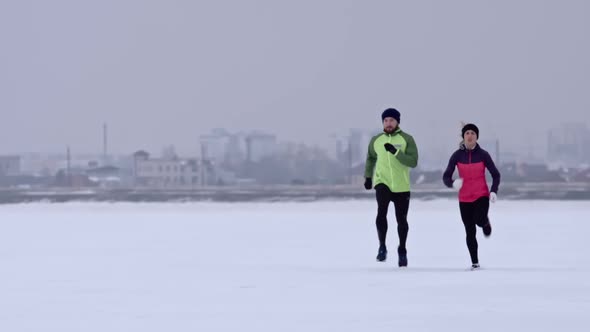 Couple Preparing for Winter Marathon