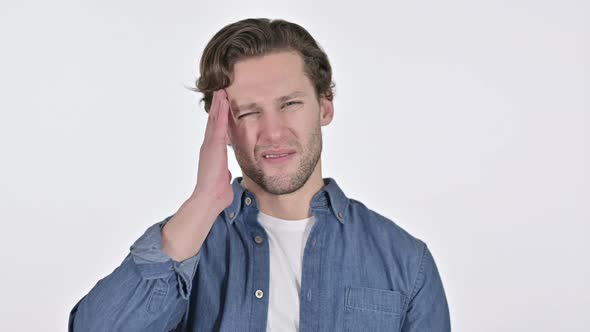 Young Man Having Headache, Pain in Head on White Background