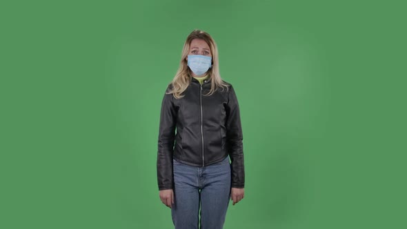 Portrait of Beautiful Young Woman in Medical Protective Face Mask Looking at Camera Worries 