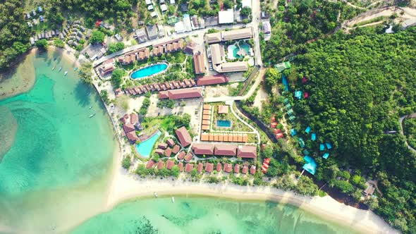 Wide aerial abstract shot of a paradise sunny white sand beach and blue sea background in vibrant 