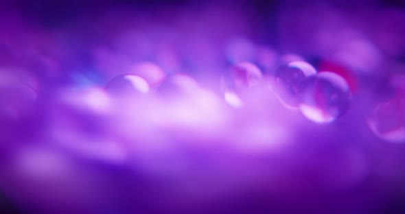 Abstract blurred shot of purple marbles