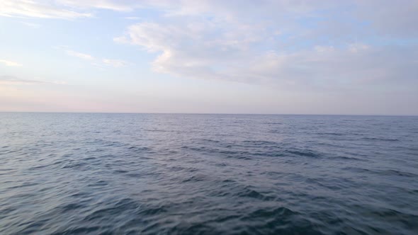 Low Flight Over The Ocean at Sunrise