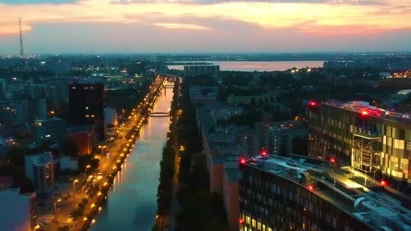 Aerial shot of a river in Bucharest at sunset