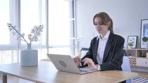 Woman Coming to Office for Work on Laptop