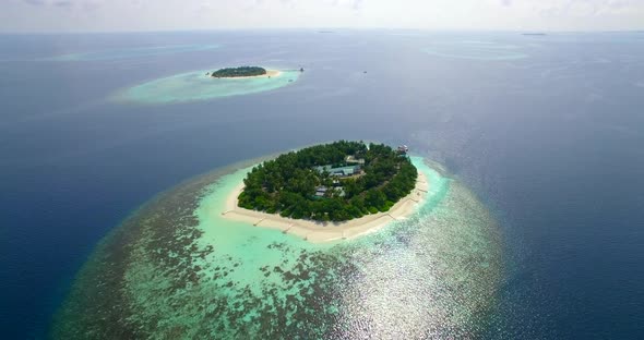 Aerial drone view of scenic tropical islands in the Maldives.