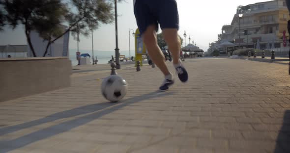 Dribbling the Soccer Ball in the City
