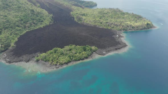 Aerial: flying over Banda Islands active volcano Gunung Api lava flows Maluku In