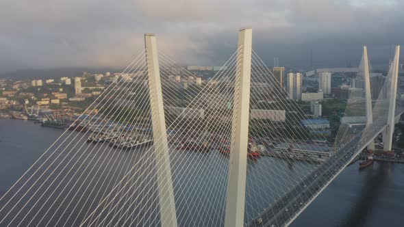 View From a Drone Vertically Down to the Golden Bridge and the City at Sunset