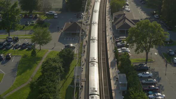 Aerial View of a Train Stopped at a Station in Long Island New York