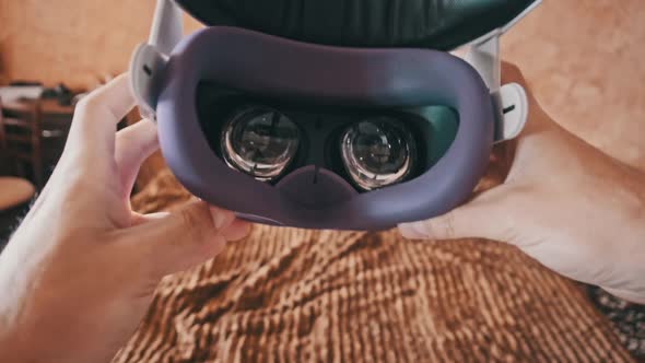 POV of Putting on VR Glasses Virtual Reality in the Bedroom