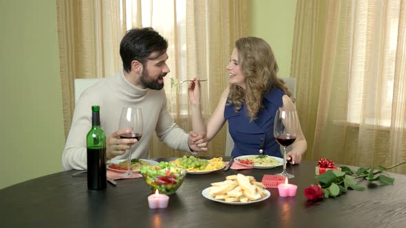 Woman Feeding Man