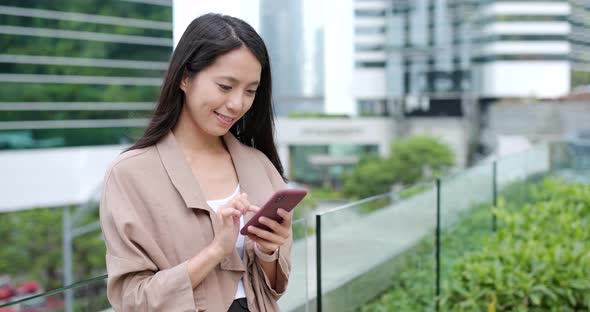 Woman working on smart phone