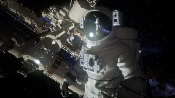 Astronaut Outside the International Space Station on a Spacewalk alt