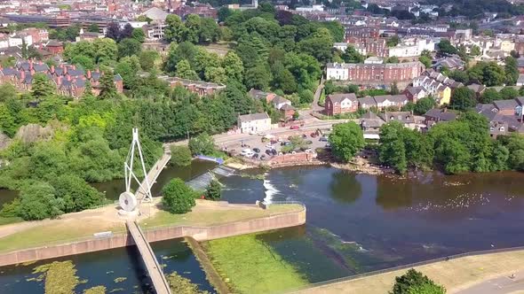 Flying over a pedestrian bridge on the River Exe in Exeter, Devon