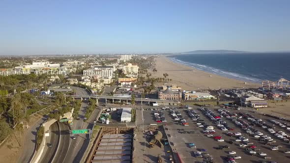 1 million $ aerial view flight drone footage of Santa Monica Pier, daytime no clouds.Perfect slider