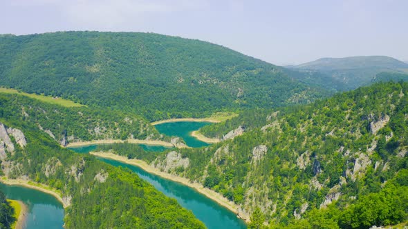 Winding Blue River Meandri Cehotine on the Mountains with Green Forest in Pljevlja Montenegro