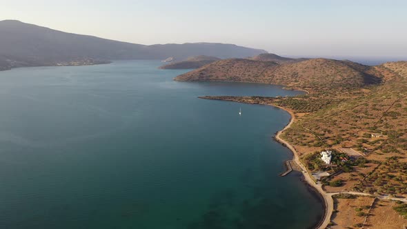 Aerial View of a Motor Boat in a Deep Blue Colored Sea. Kolokitha Island, Crete, Greece