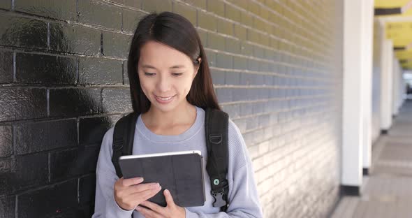 Woman use of digital tablet computer at outdoor