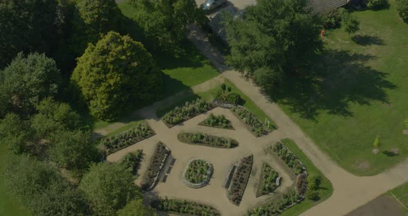 Slow Aerial Tilt Down of a Landscaped Garden Near Arboretum in Long Island