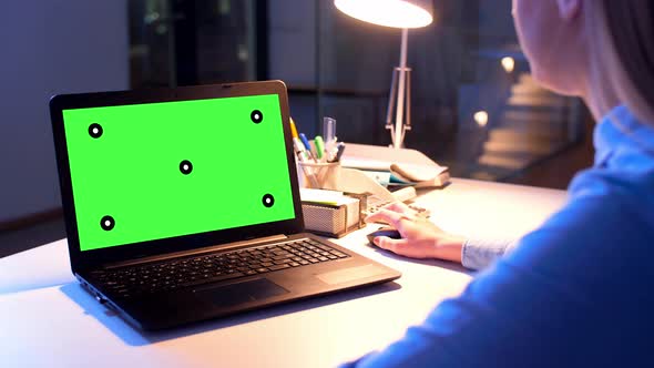 Businesswoman with Green Screen on Laptop at Night 5