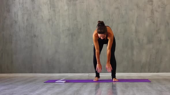 Woman Sports Clothes Leggings and a Tank Top Engaged Yoga Studio with