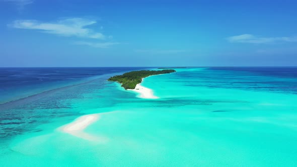 Natural fly over travel shot of a sunshine white sandy paradise beach and blue water background in h