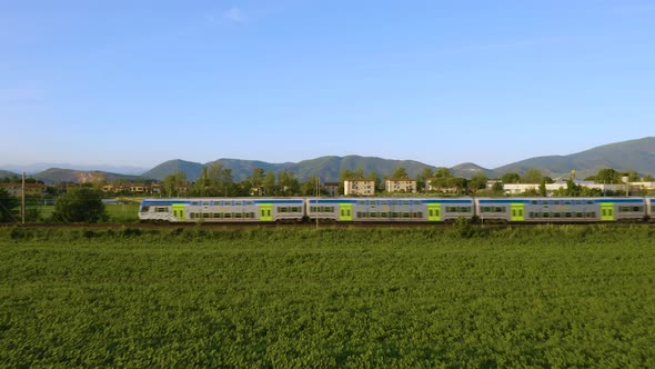 Train Transit Over Green Meadow
