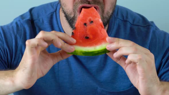 Bearded Man Eats a Juicy Watermelon