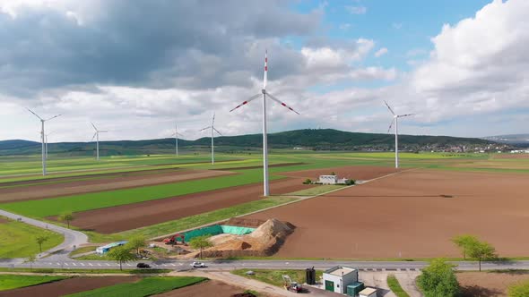 Aerial View of Wind Turbines Farm and Agricultural Fields. Austria