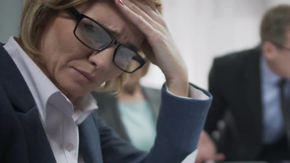 Female Office Worker Upset At Conference, Feels Headache, Boss Angry About Fail