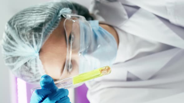 Vertical Video of Medical Scientist Inspecting Minced Meat Working in Laboratory