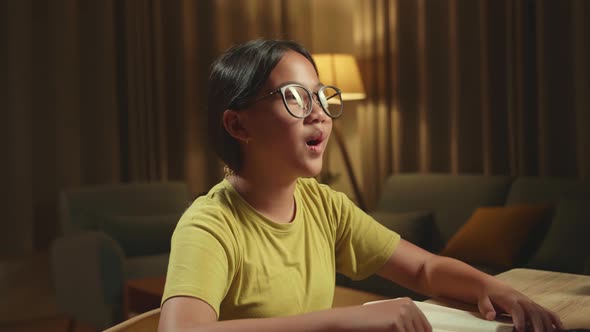 Girl Learning Online From Home, Raising Hand Distance Learning Online While Using Desktop Computer