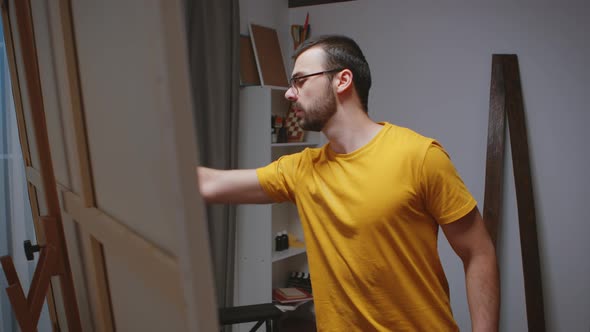 Guy Painting on Large Canvas