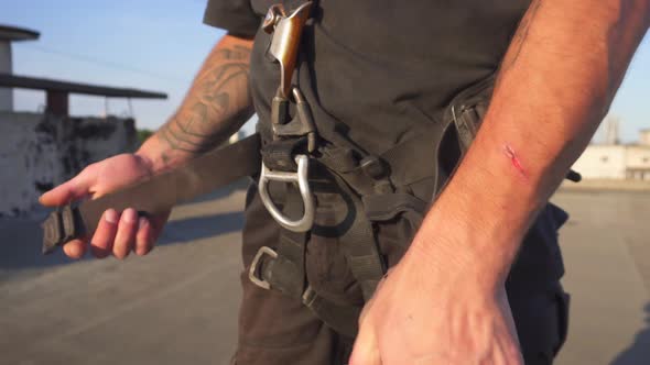 Industrial Climber Puts on Equipment for Highaltitude Work