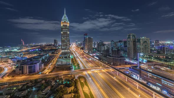 Skyline Internet City with Crossing Sheikh Zayed Road Aerial Night Timelapse