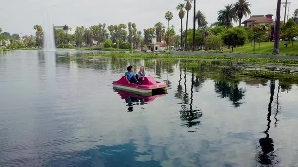 Cute Couple Enjoying A Boat Ride In The Park