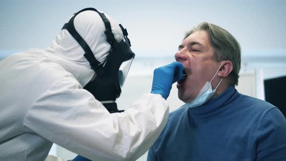 Paramedic Is Taking Patient's Saliva for Testing. Infection, Covid-19 Pandemic, 2019-Ncov Concept.