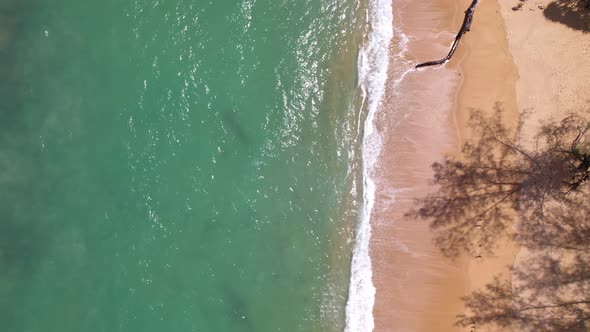 Beautiful texture of big waves power ocean waves with white waves break on beach sand at Phuket