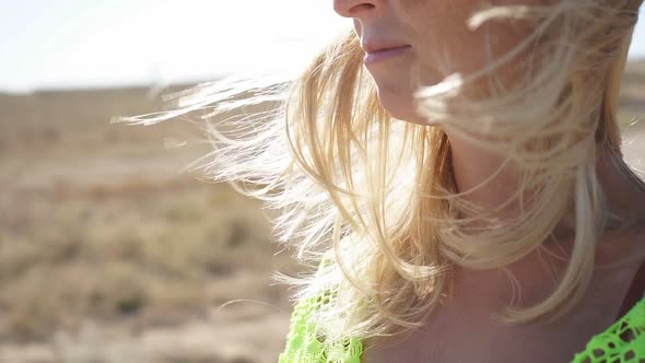 Closeup of Hair Fluttering in the Wind on a Sunny Summer Day