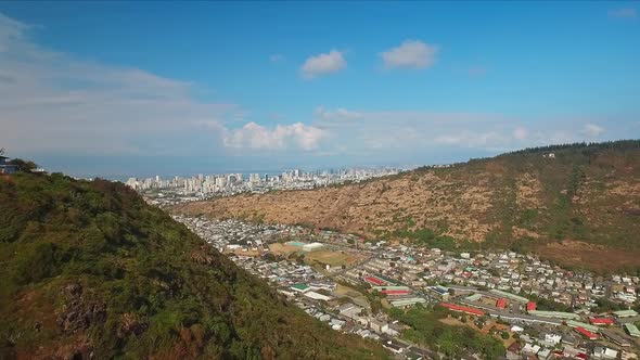 Aerial view overlooking valley and Waikiki cityscape and Pacific ocean