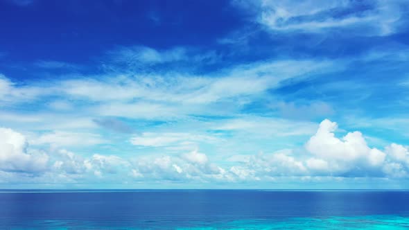 Aerial view tourism of tranquil seashore beach break by turquoise lagoon and white sandy background 