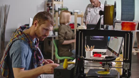 Bearded Entrepreneur Working on FDM 3D Printer