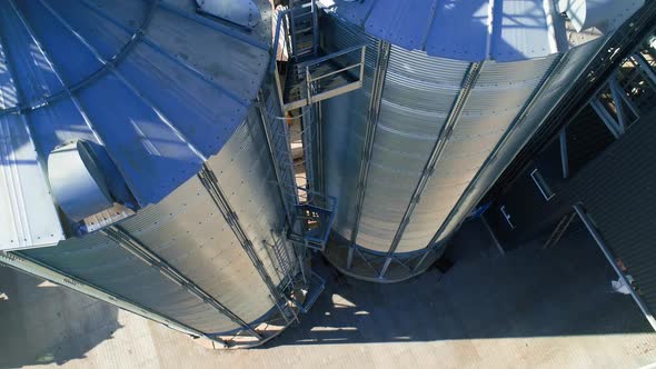 Grain Cooperative. Large aluminum containers for storing loose grain. Aerial view