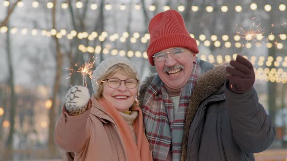 Senior Couple On Rink With Sparklers