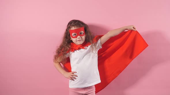 Attractive Cute Kid Wearing Red Superhero Suit and Mask