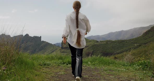 Young Woman Walks and Enjoys the View of Masca Gorge